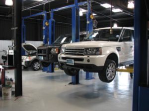 Range Rover on a lift for repair at Dr Auto Tech in Hermosa Beach