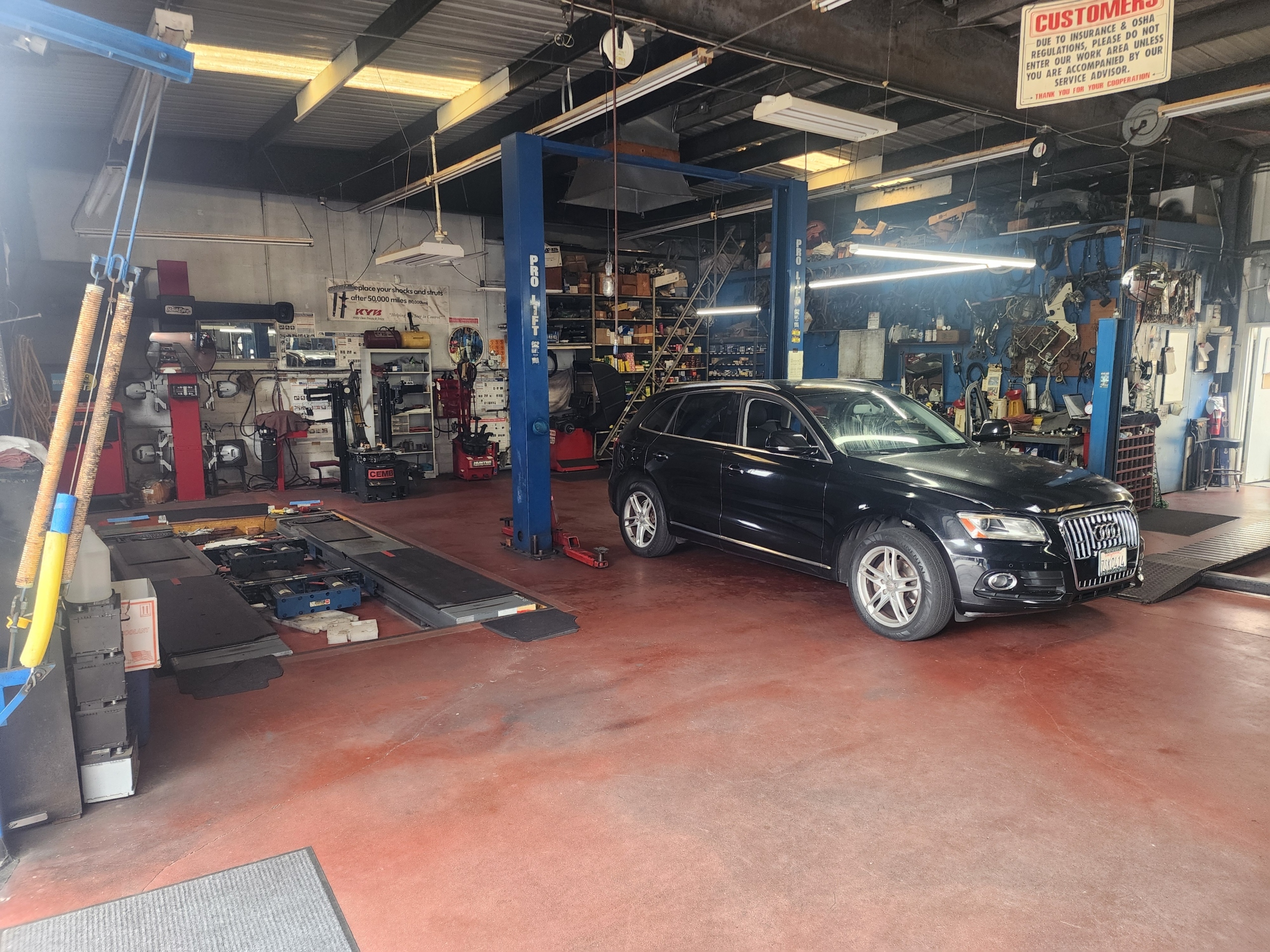 In-House Alignment, Wheel Balancing and Tire Service Dr Auto Tech service bay with alignment, tire and European vehicle service equipment
